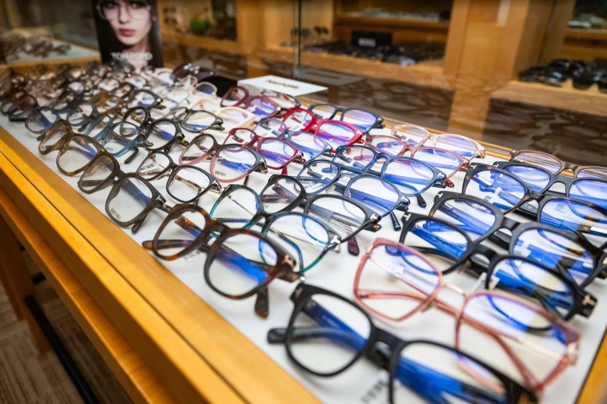 Rows of Tom Ford frames in a lit display case at Voorthuis