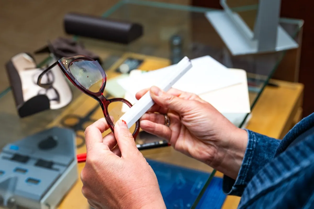 Adjusting a cat-eye frame by hand at the Voorthuis bench